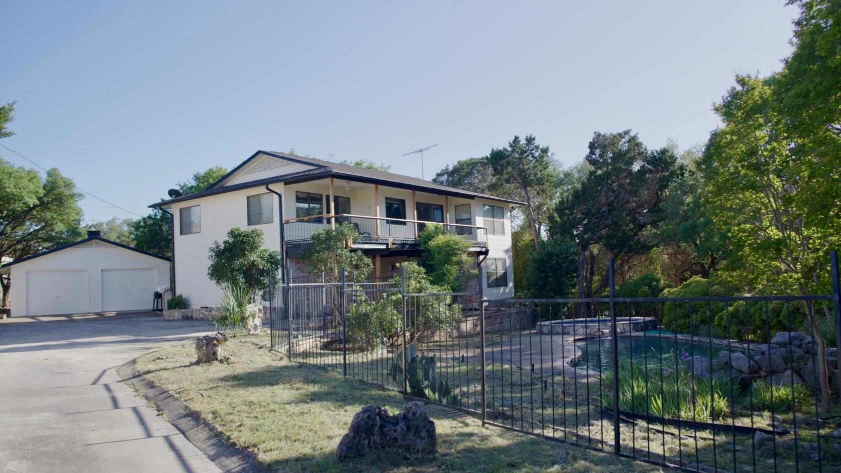 View of front facade featuring an outdoor structu