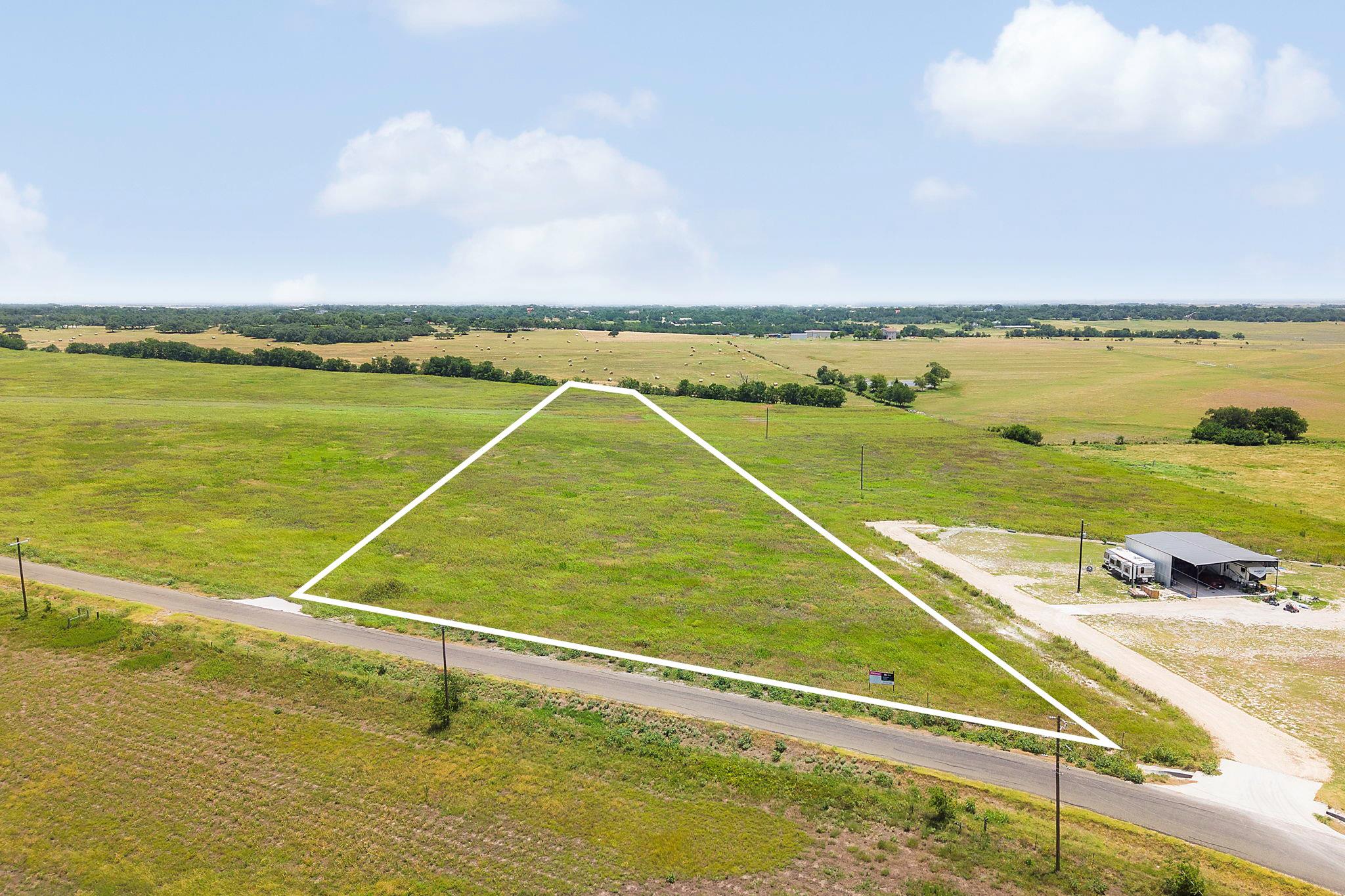 A verdant parcel of land awaits your vision, bord