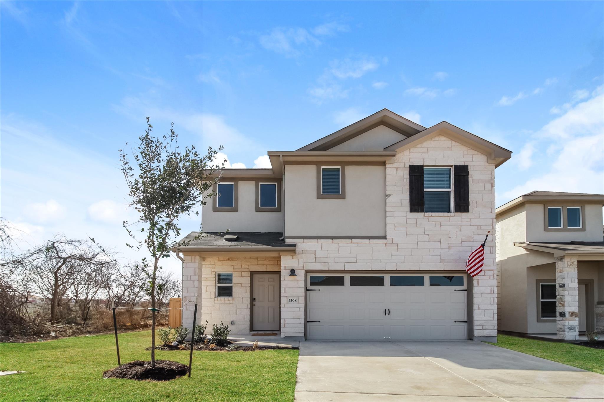 A classic stone and stucco exterior pairs with a 