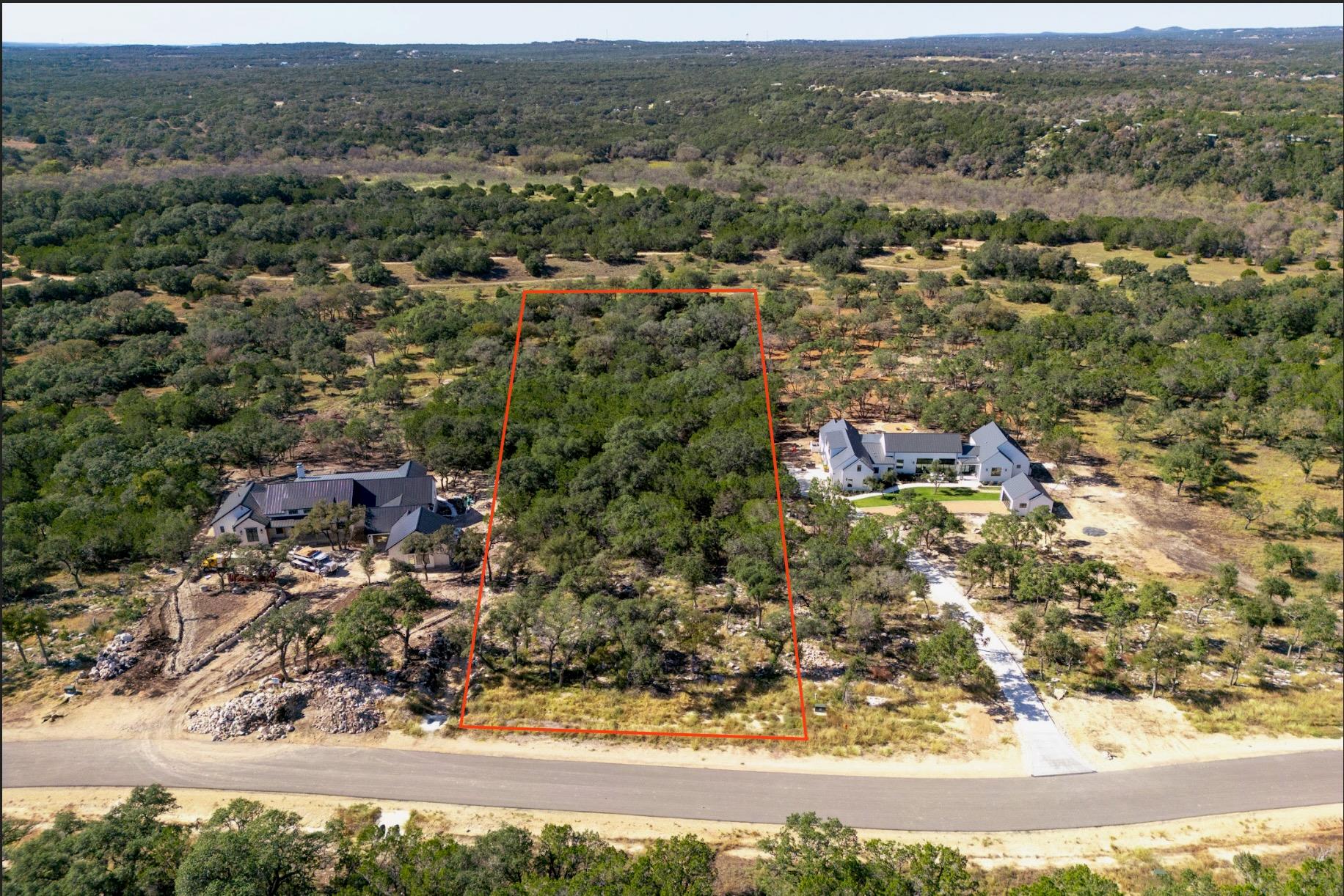 Drone / aerial view with a wooded view
