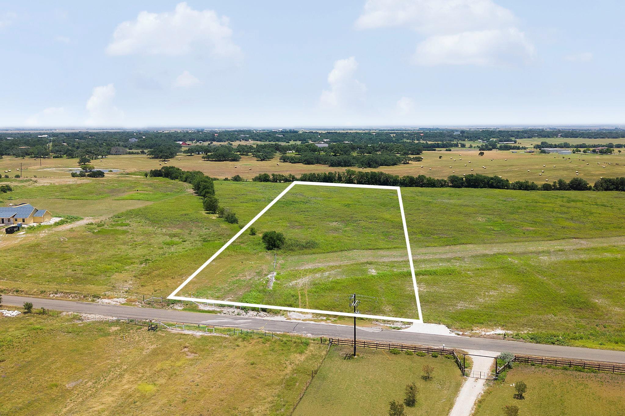 A spacious, buildable plot of land with verdant f