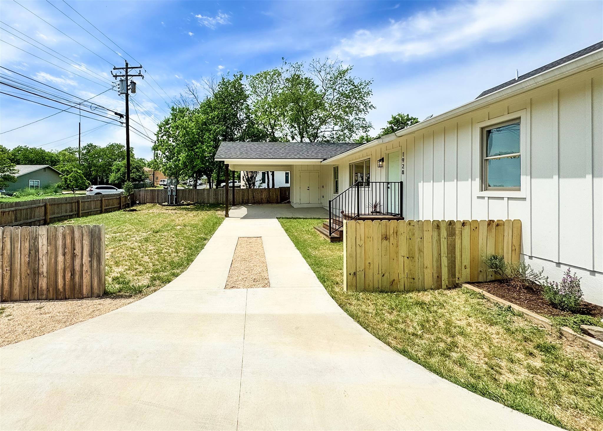 View of yard featuring fence