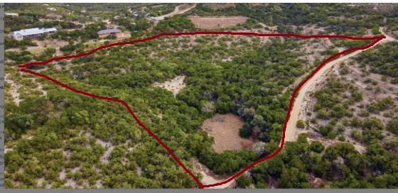 Aerial view of property and surrounding area with