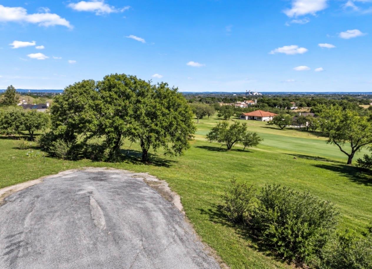 Lush fairways and mature shade trees border the e