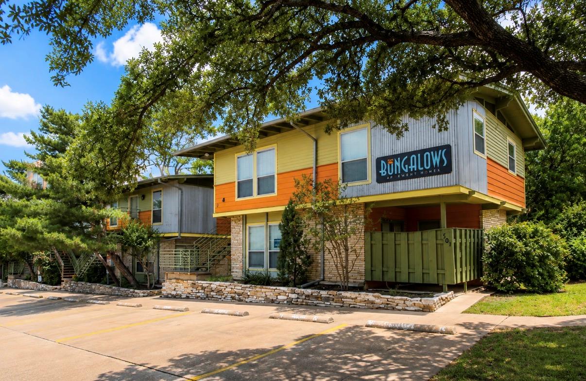 A vibrant facade with contrasting siding and ston