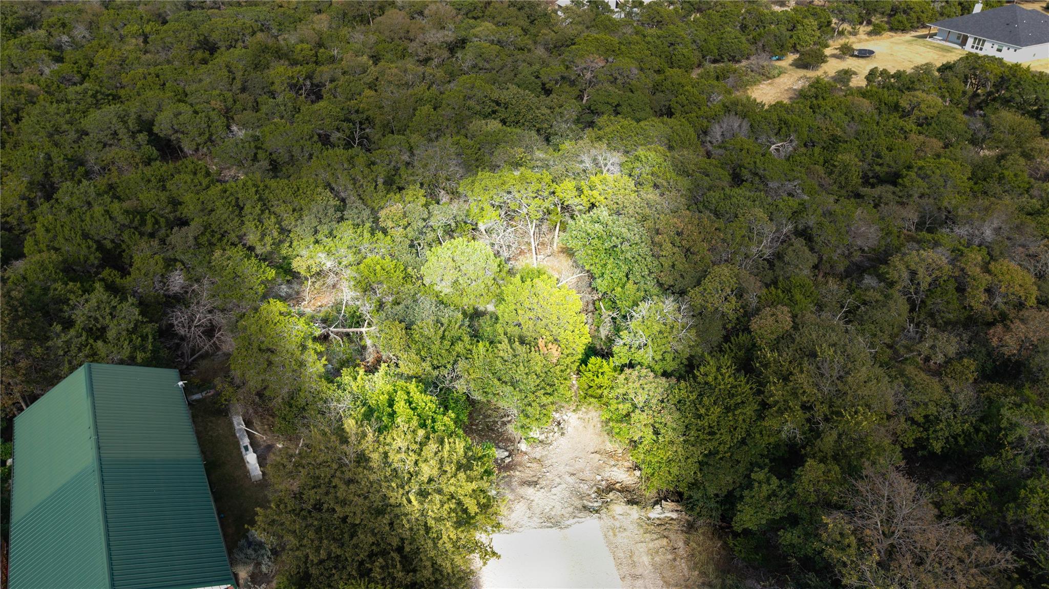 Aerial overview of property's location with a lar