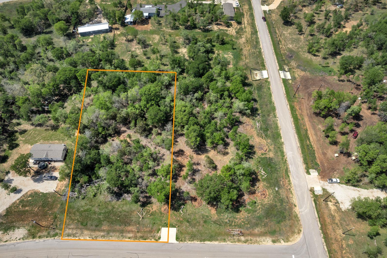 Aerial view of property and surrounding area with
