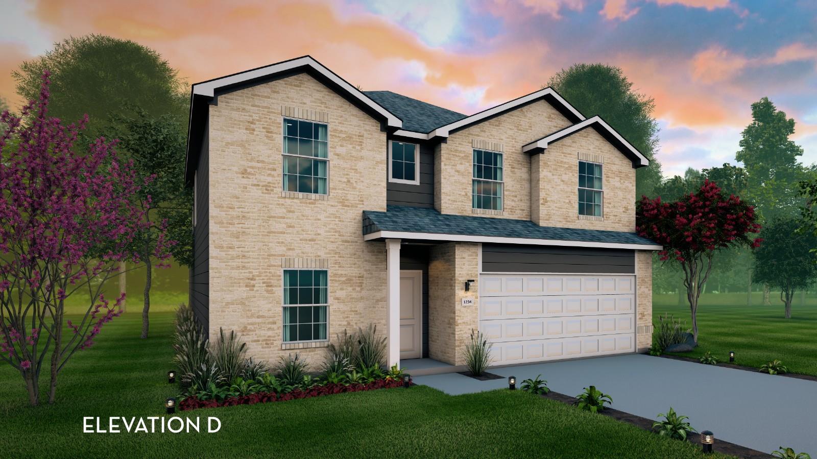 Traditional home featuring a garage, brick siding