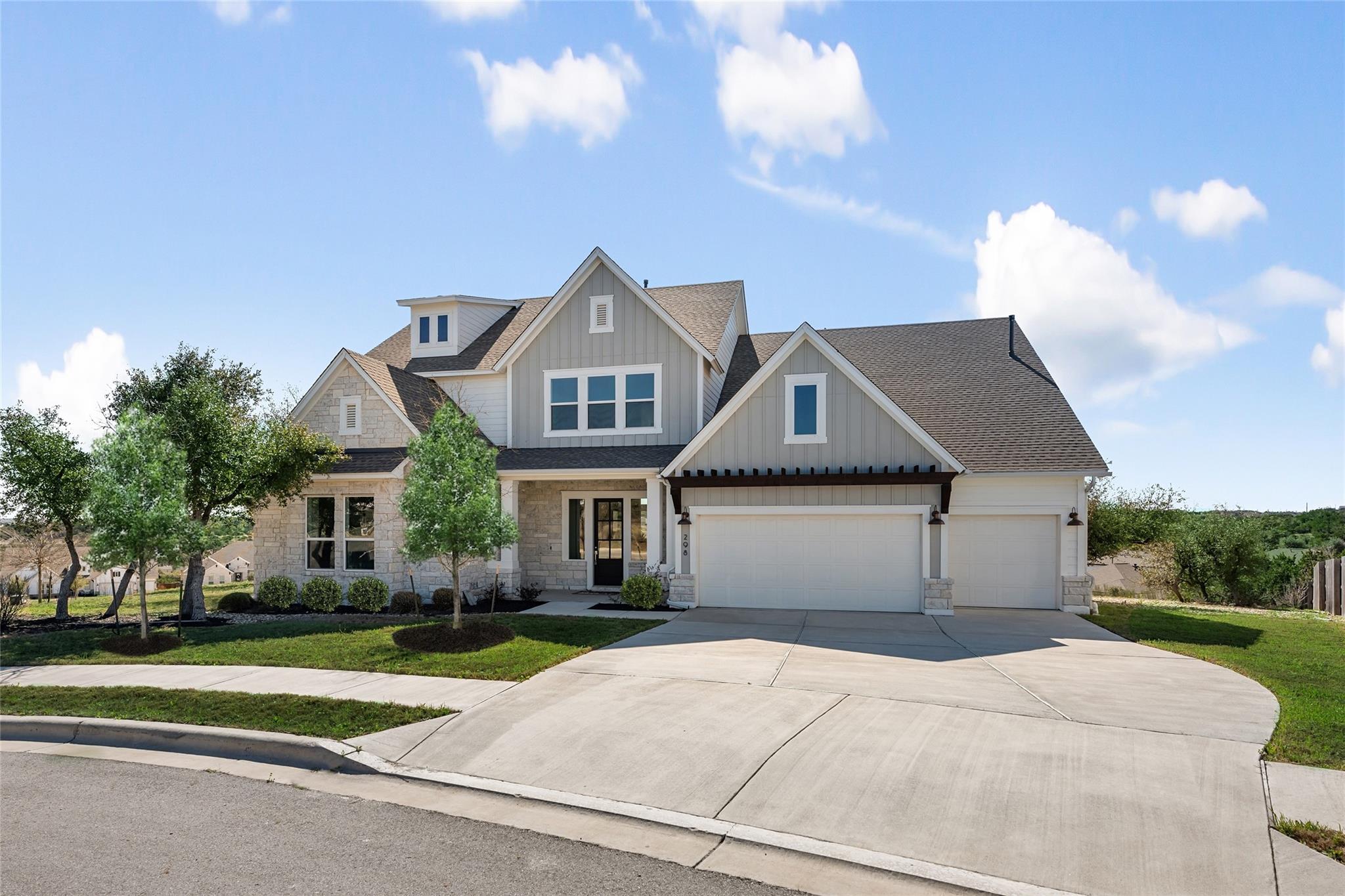Craftsman inspired home with a garage, stone sidi