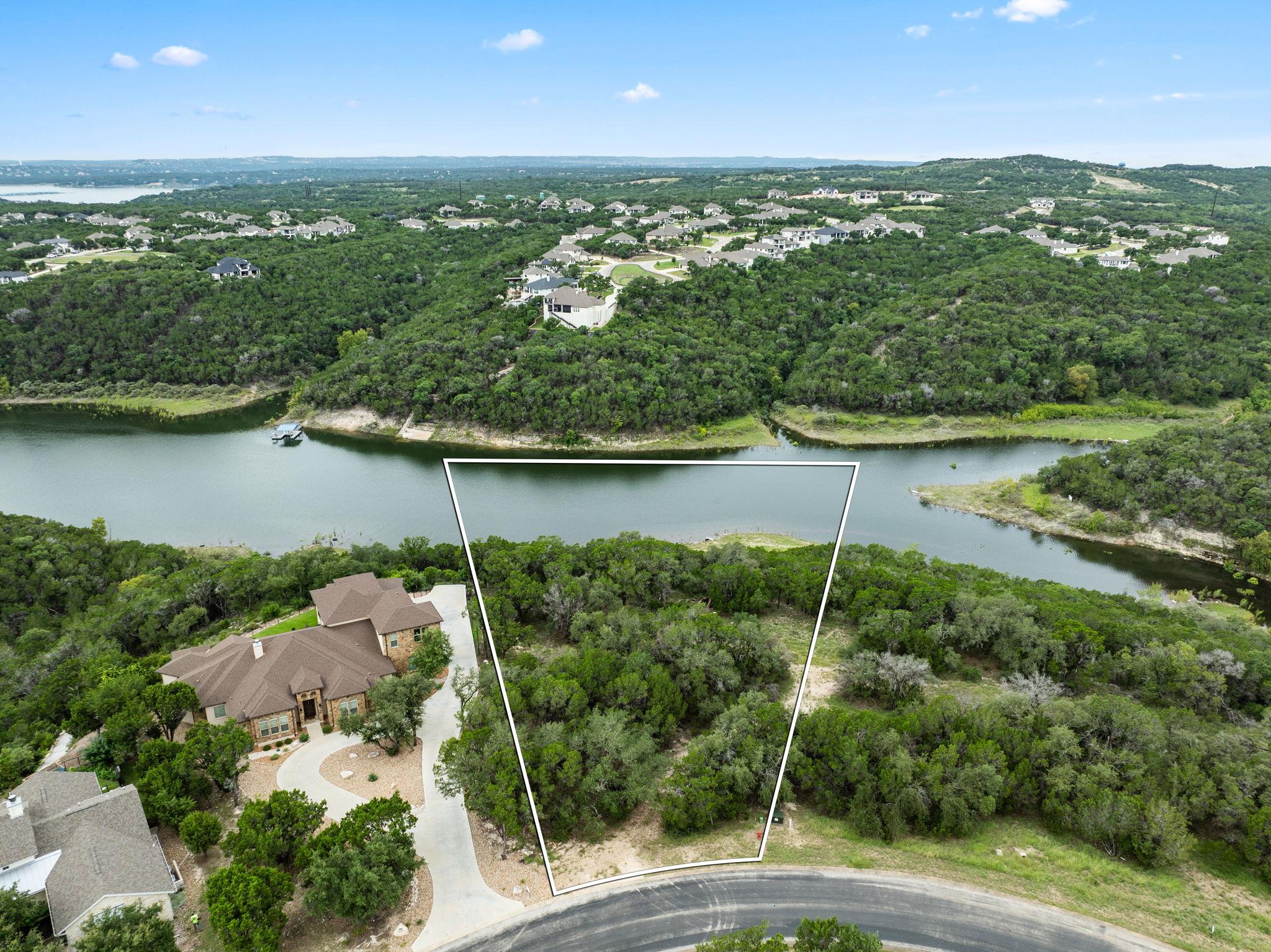View of property location with a nearby body of w