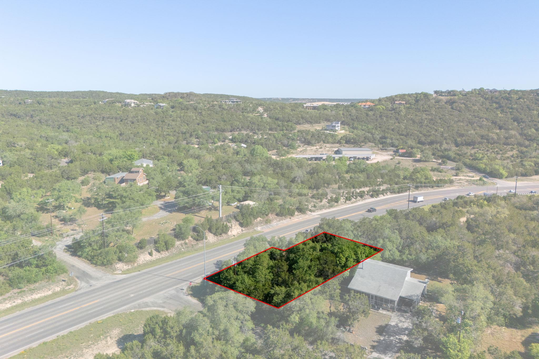 Birds eye view of property with a forest view