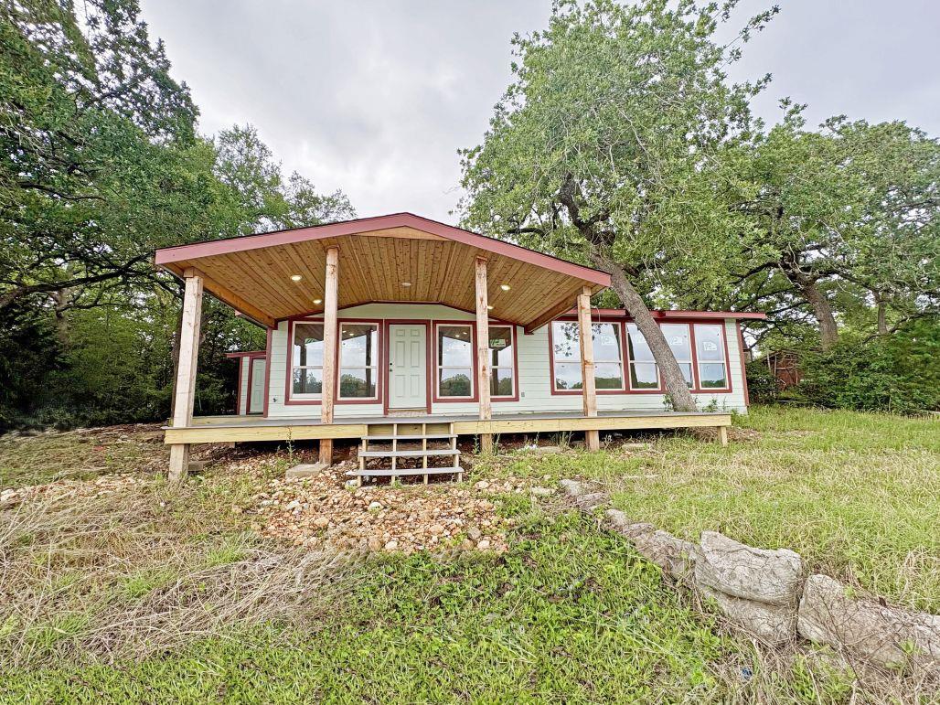 Back of property featuring a porch