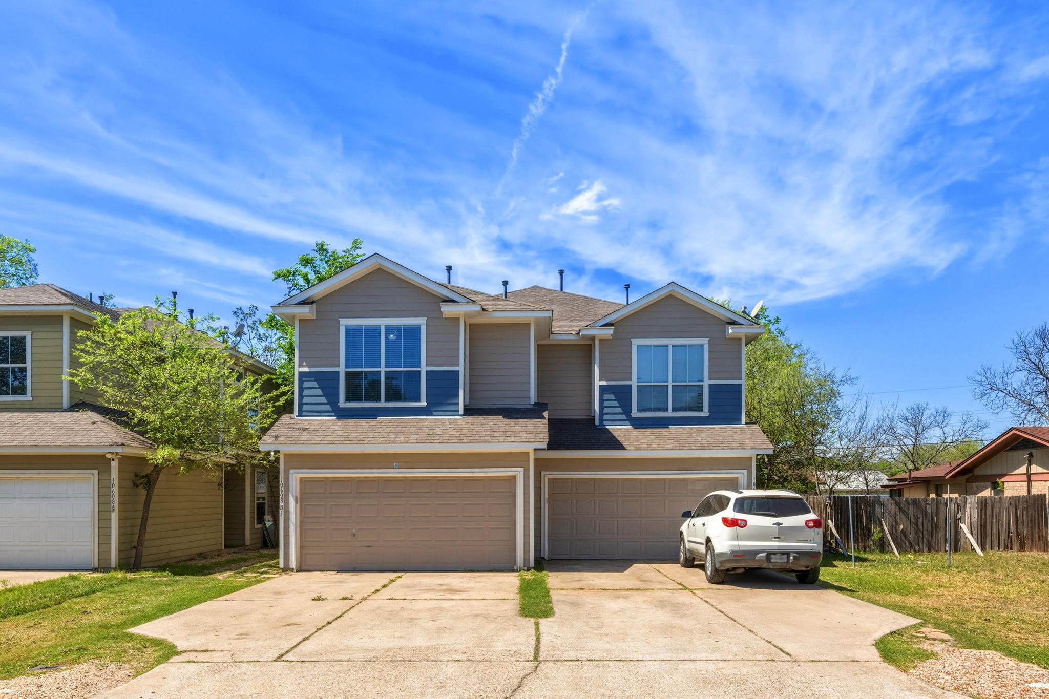 View of front of property featuring a shingled ro