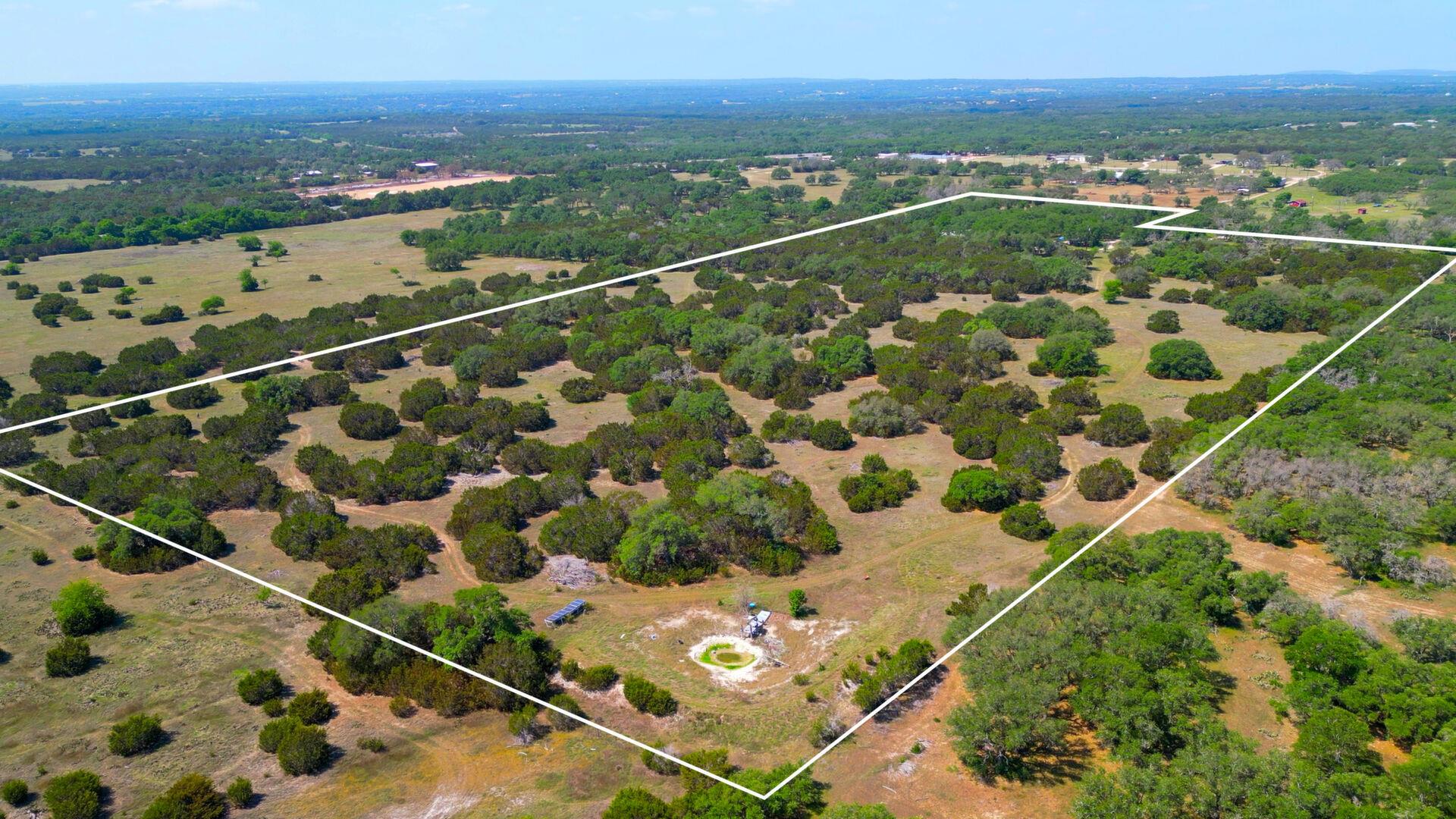 Birds eye view of property with a rural view