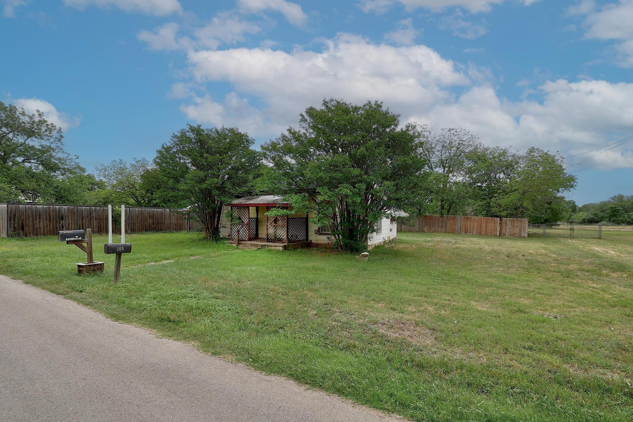 View of yard featuring fence