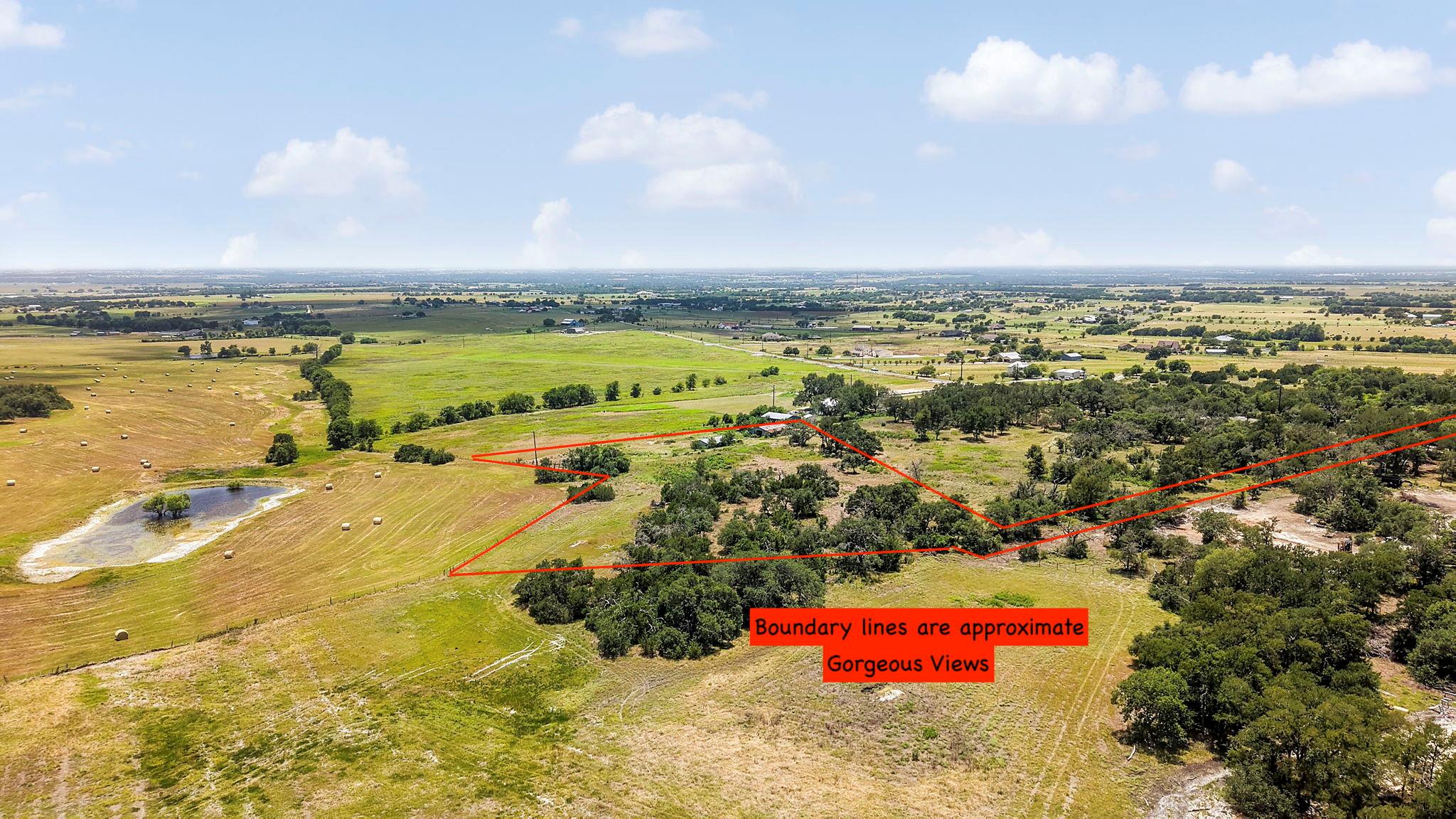 Sprawling acreage with a private pond offers idyl