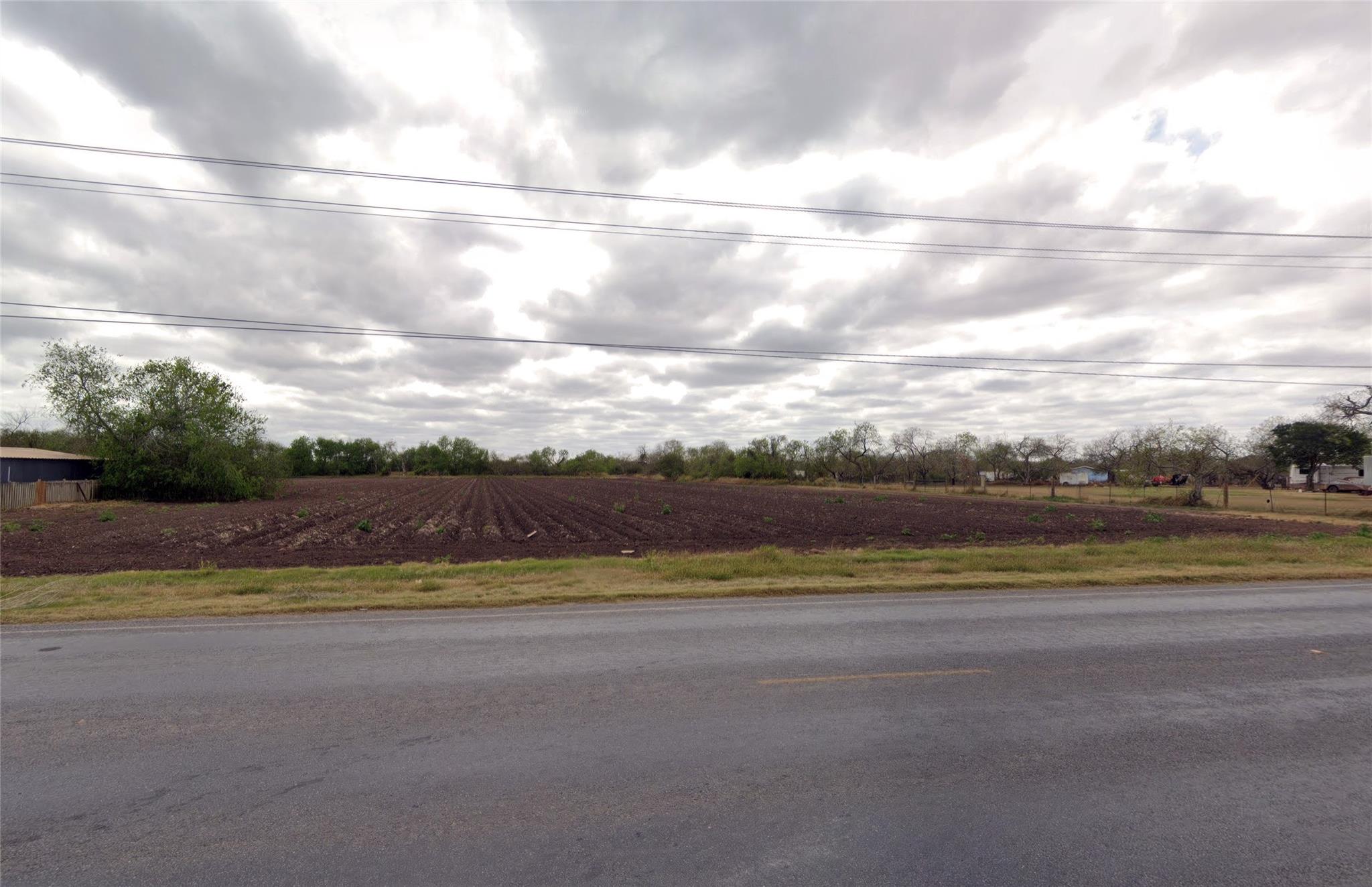 View of asphalt road featuring a view of countrys