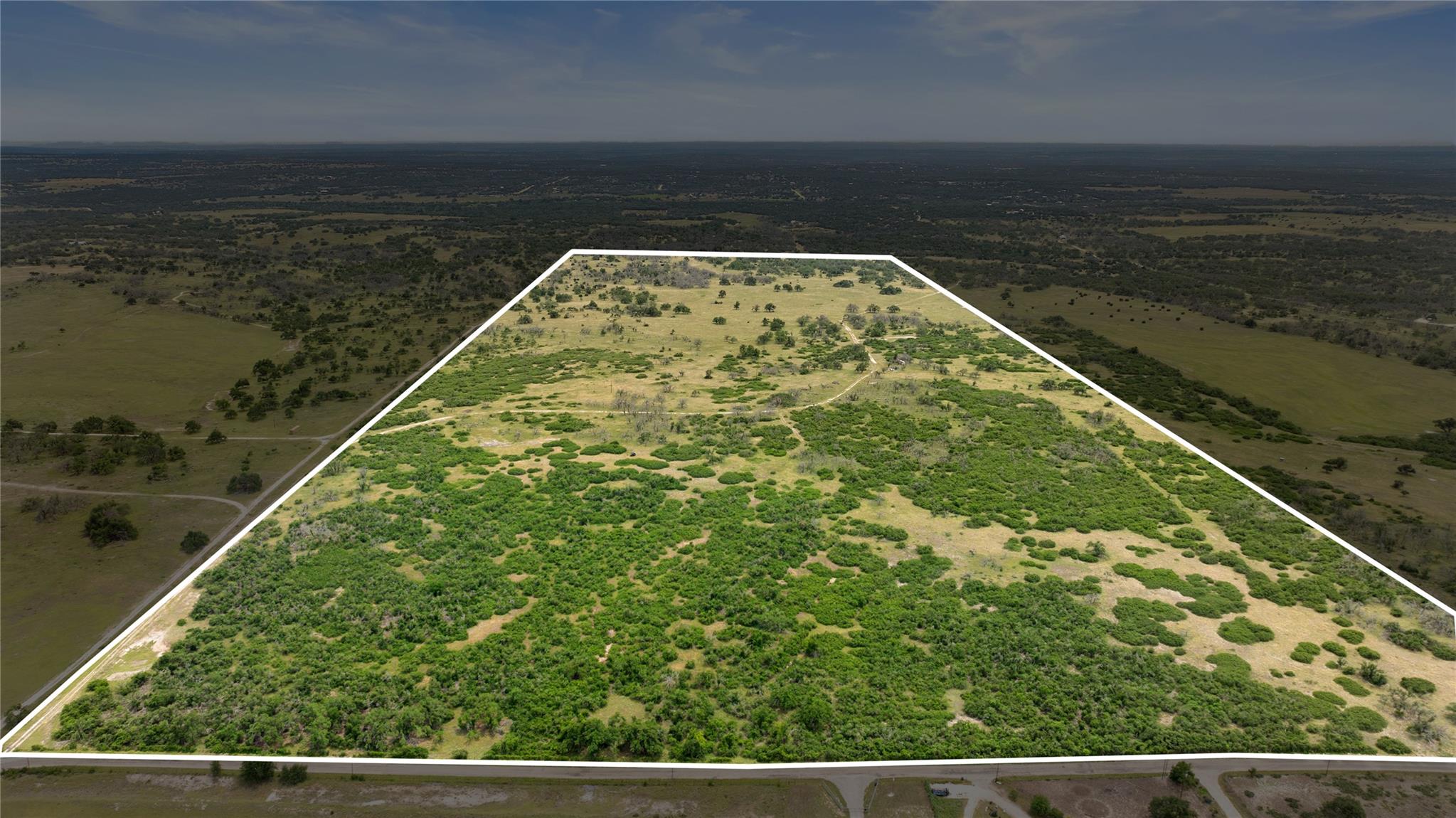 Aerial view of property and surrounding area with