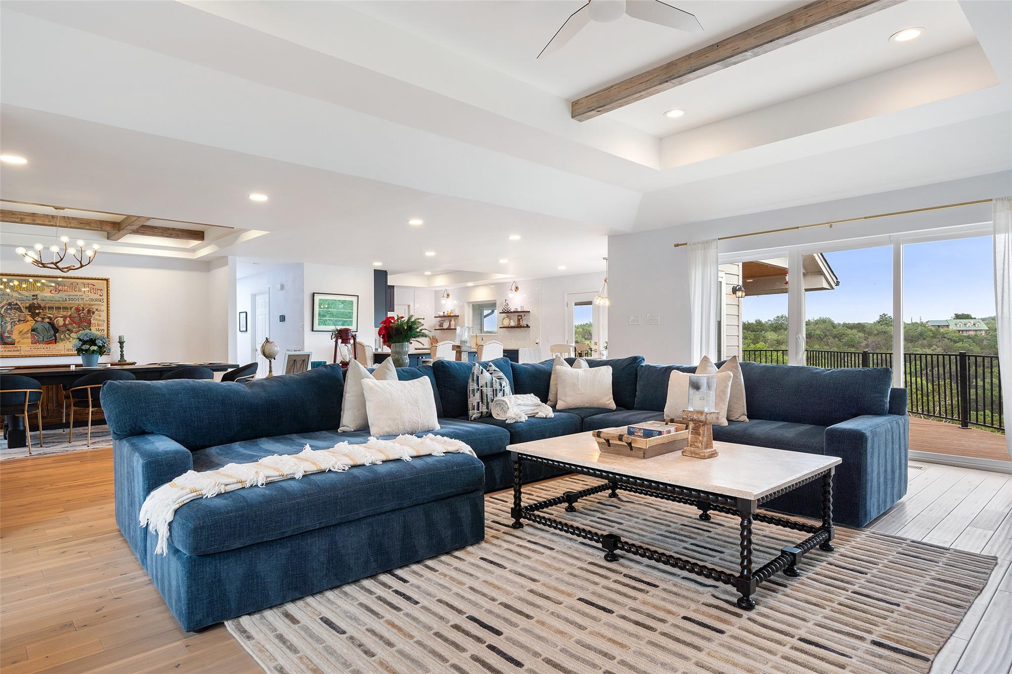 Living room featuring beam ceiling, recessed ligh