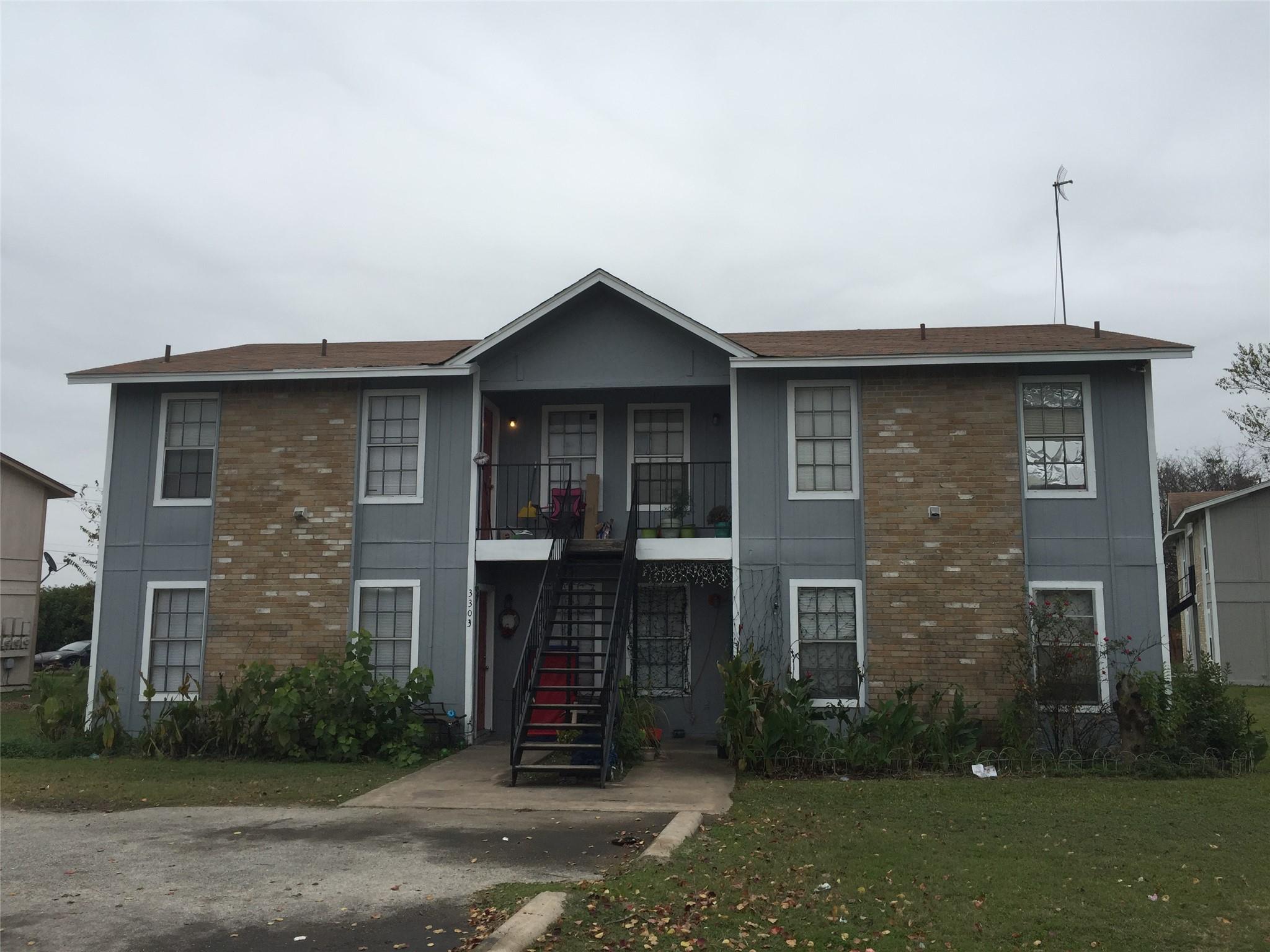 Townhome / multi-family property with stairway, a