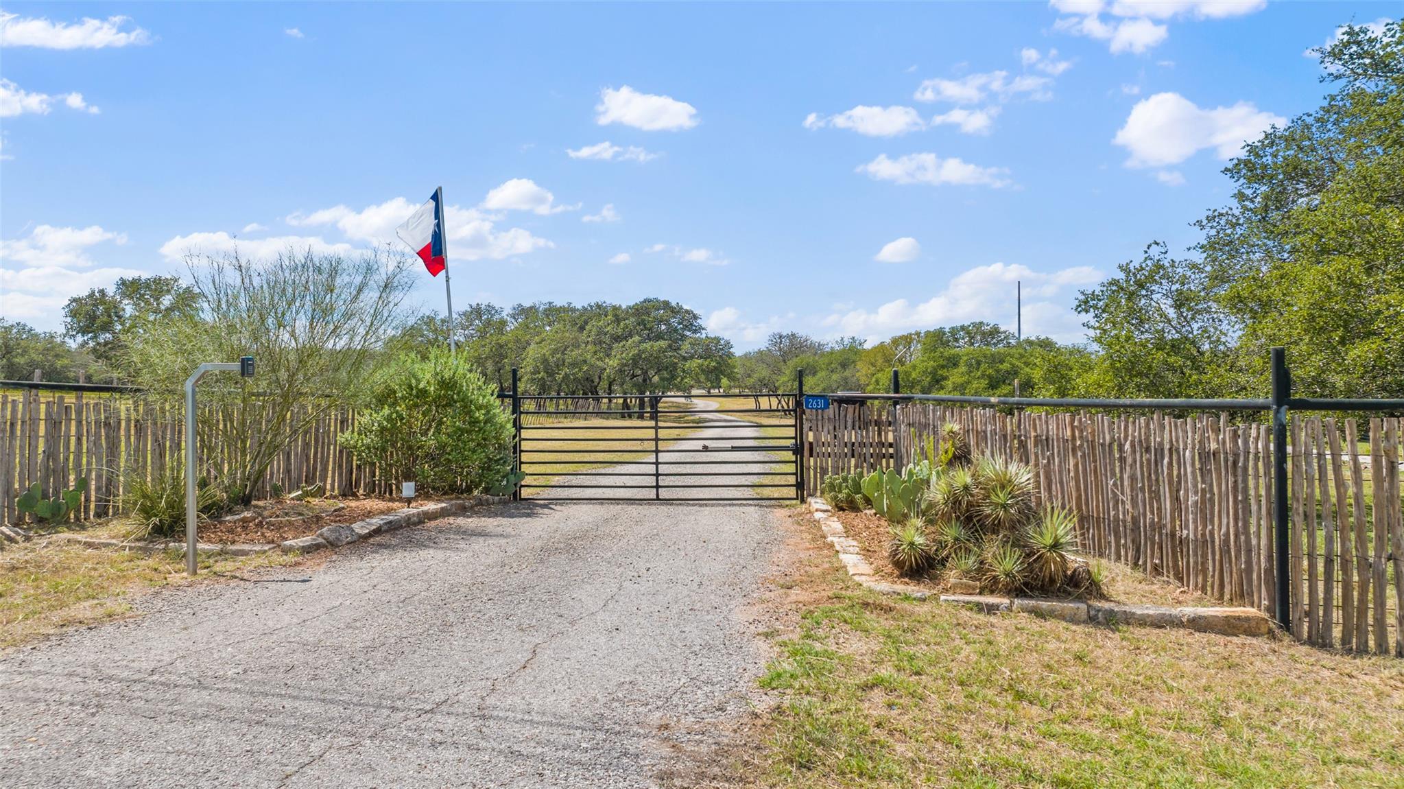 View of road featuring a gate