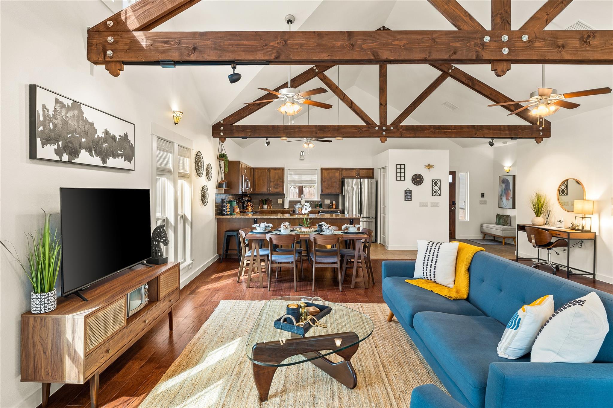 Living area featuring ceiling fan, hardwood / woo