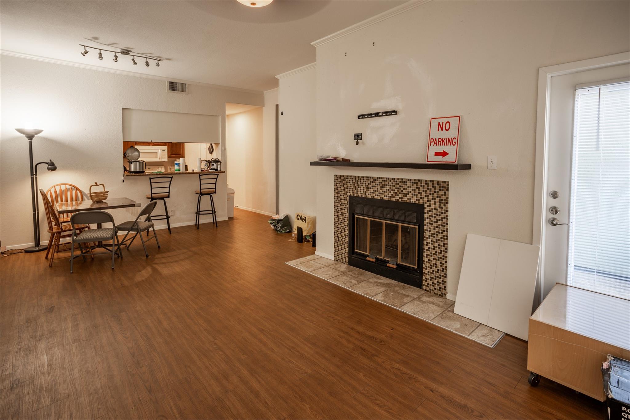 Living room with wood finished floors and a firep
