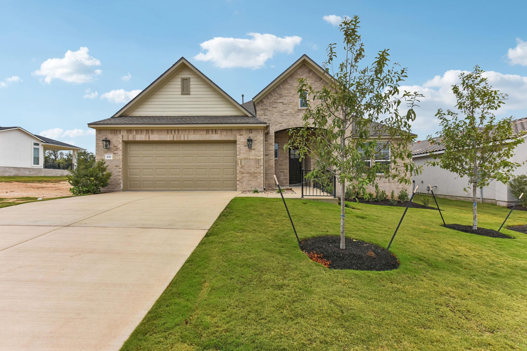 View of front of house featuring brick siding, dr