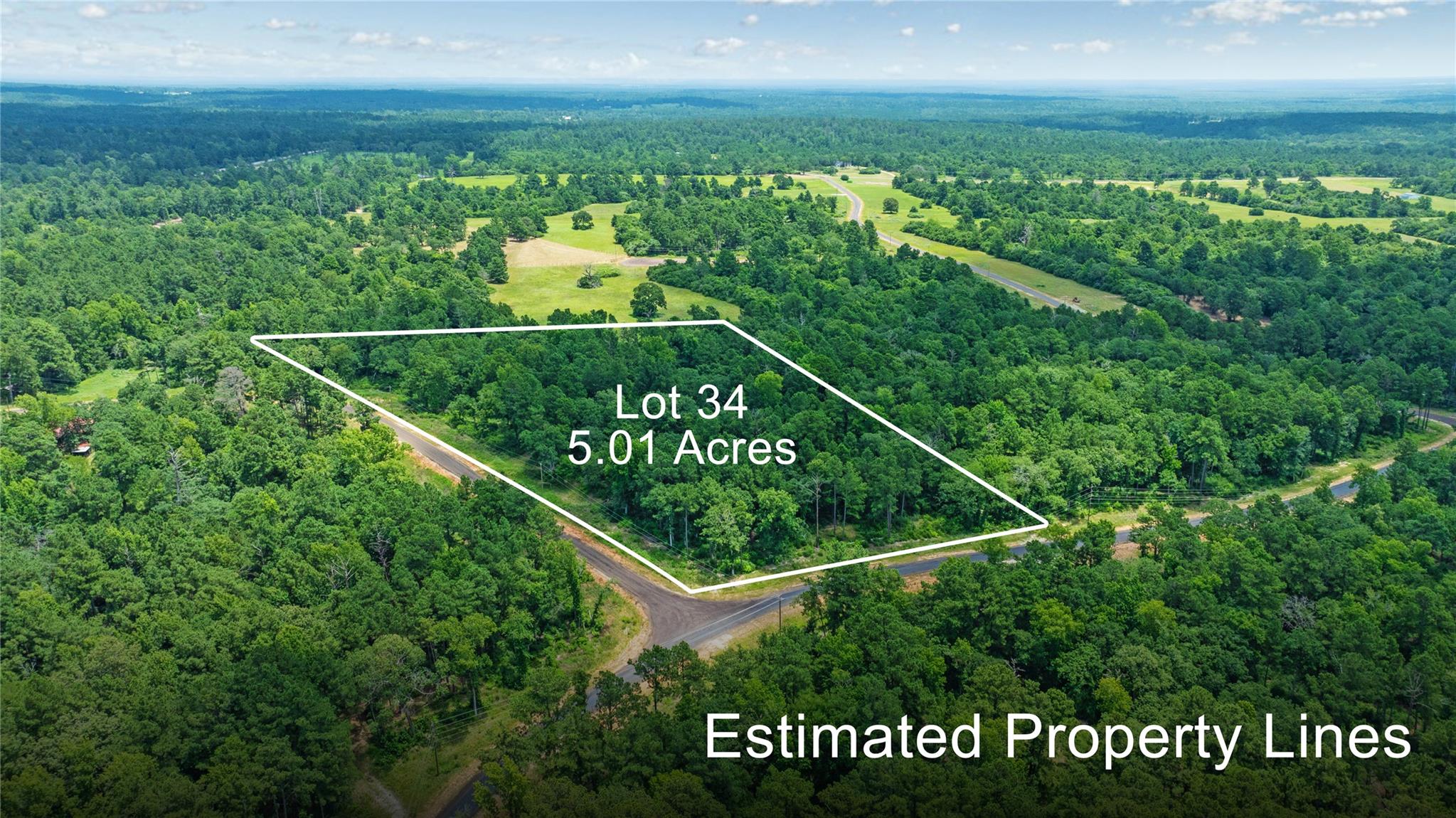 Aerial view of property and surrounding area with
