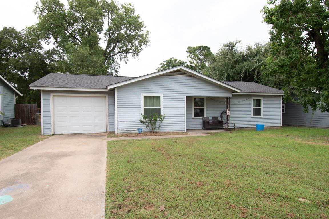 Front facade of a charming, light blue home with 