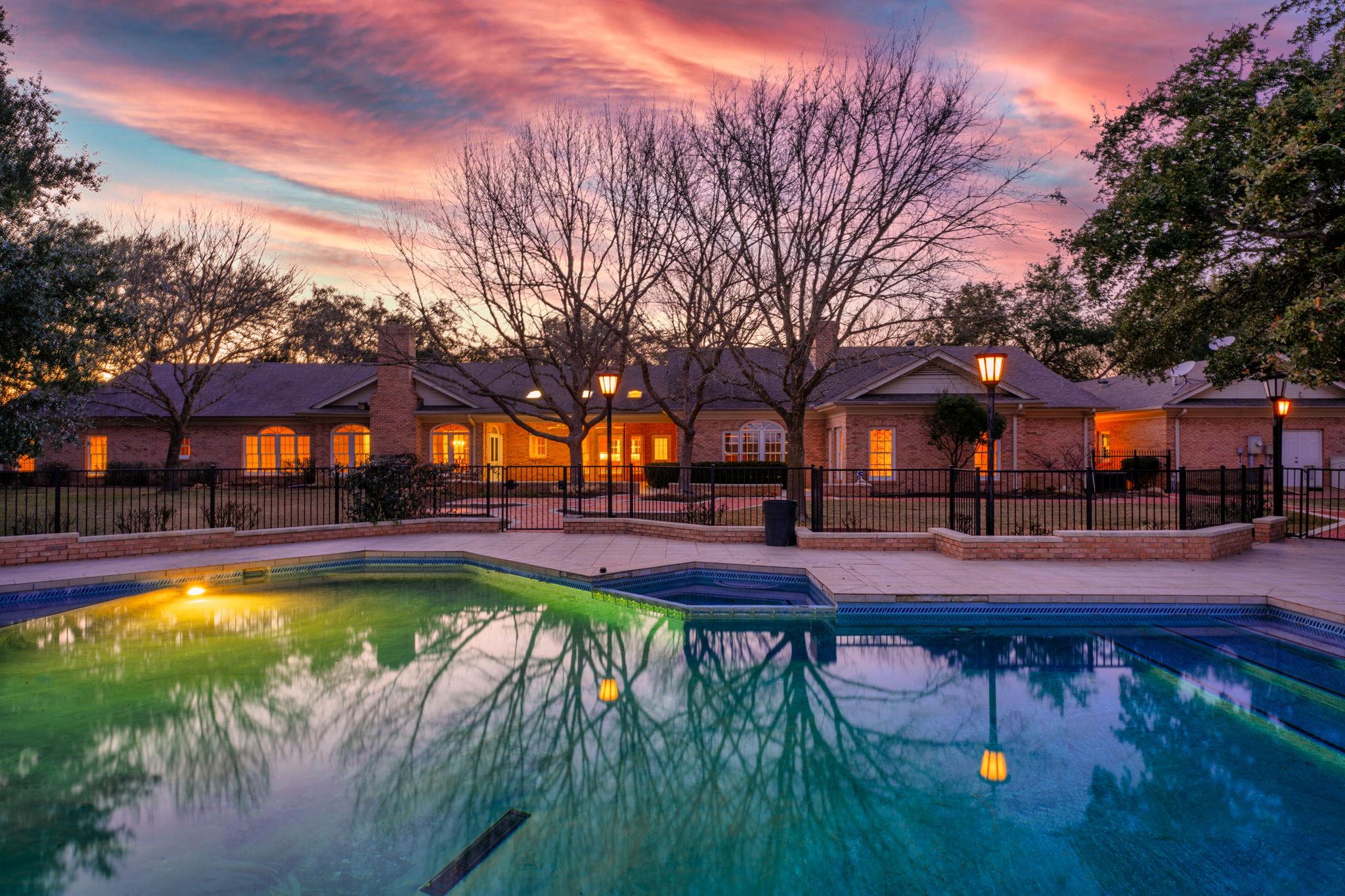 View of pool with a patio area, a pool with conne