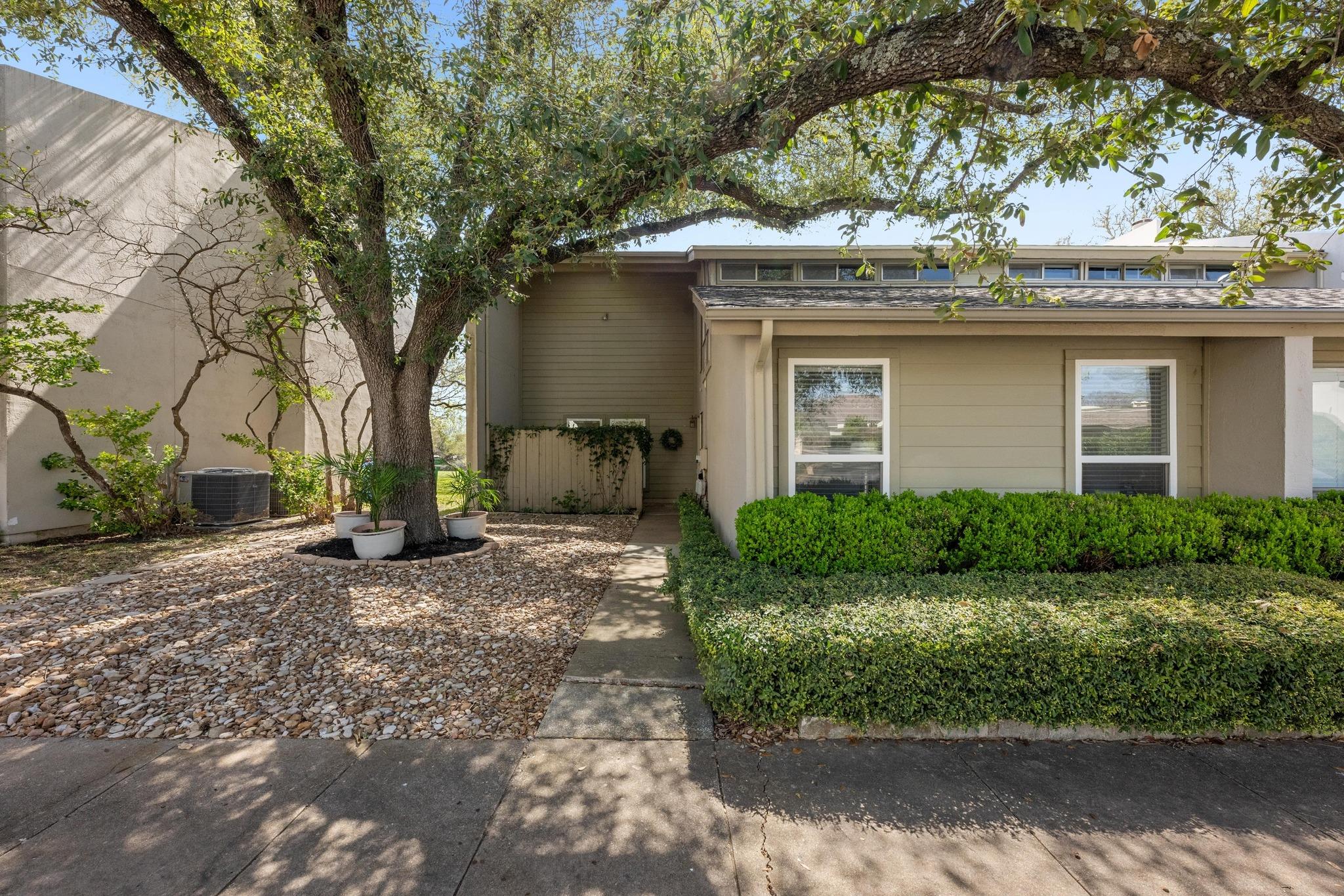 View of front of house featuring stucco siding an