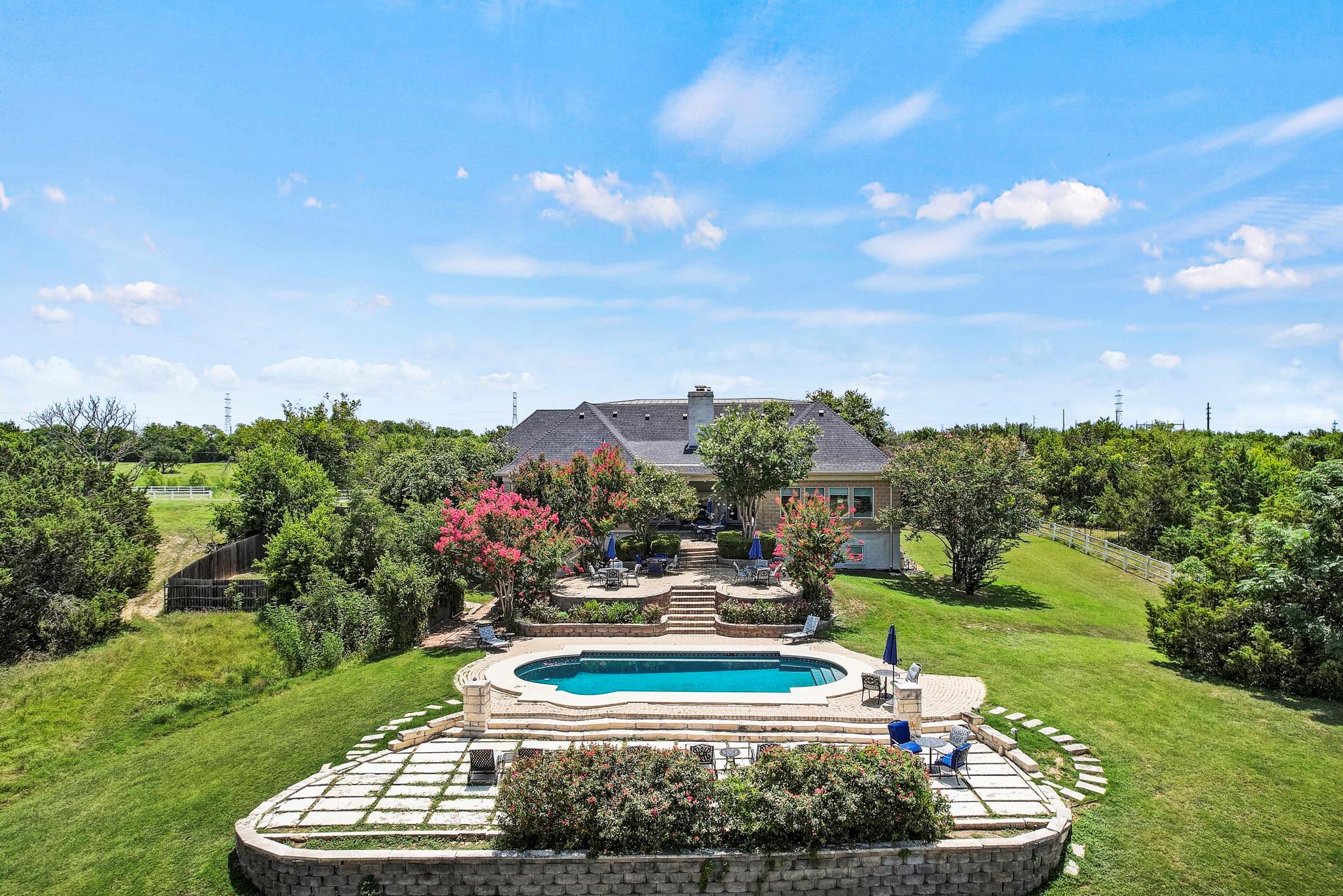 View of swimming pool with a patio, a deck, and a