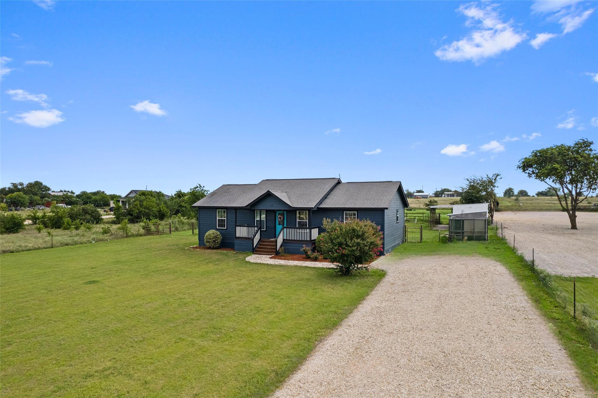 Bungalow-style house featuring driveway and cover