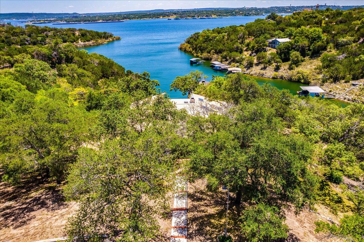 A tranquil lakefront property offers sweeping wat