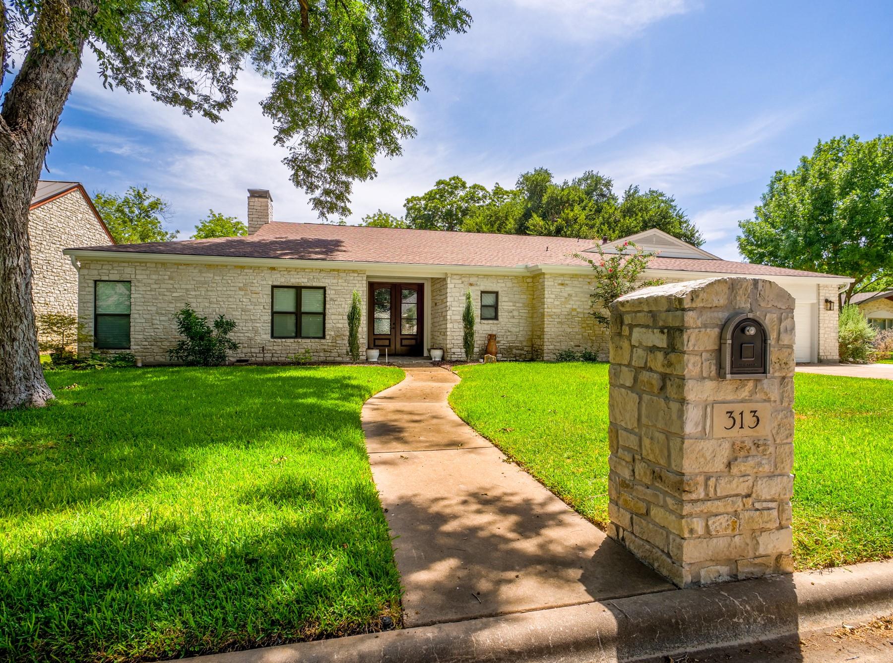 Ranch-style house featuring french doors, a front