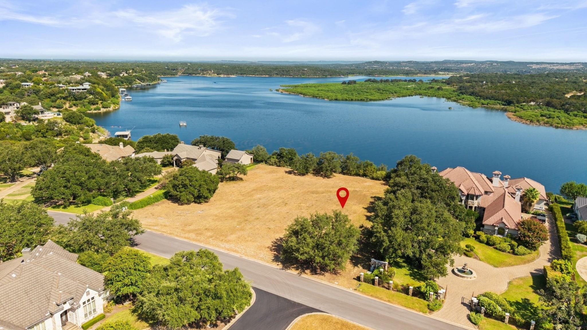 A spacious vacant lot offers scenic waterfront vi