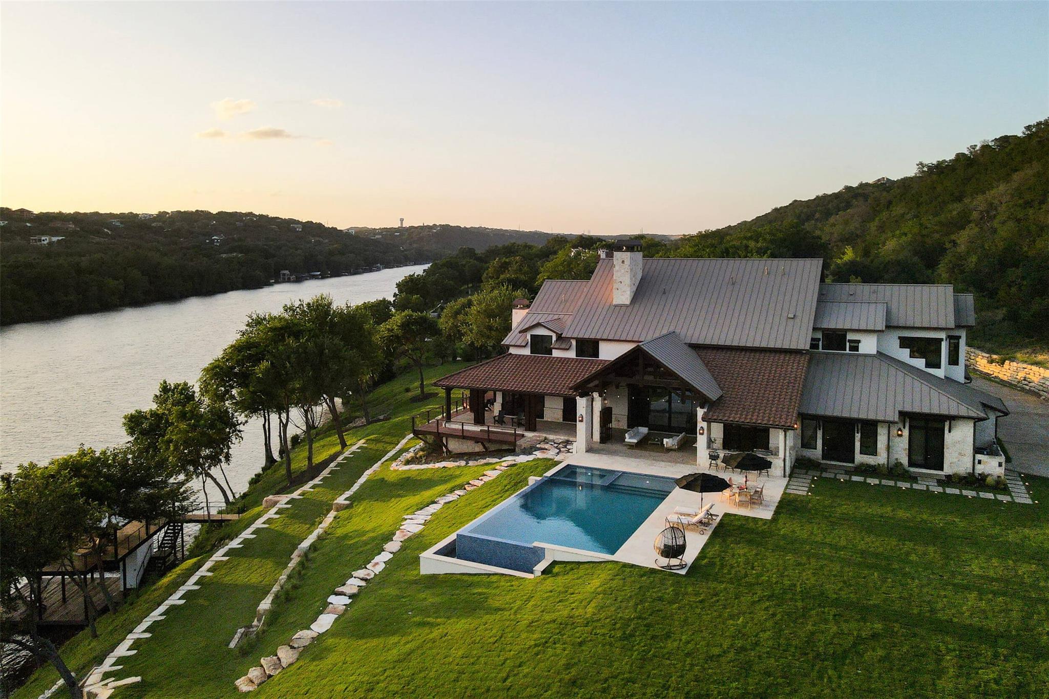View of pool featuring a yard, a patio area, and 