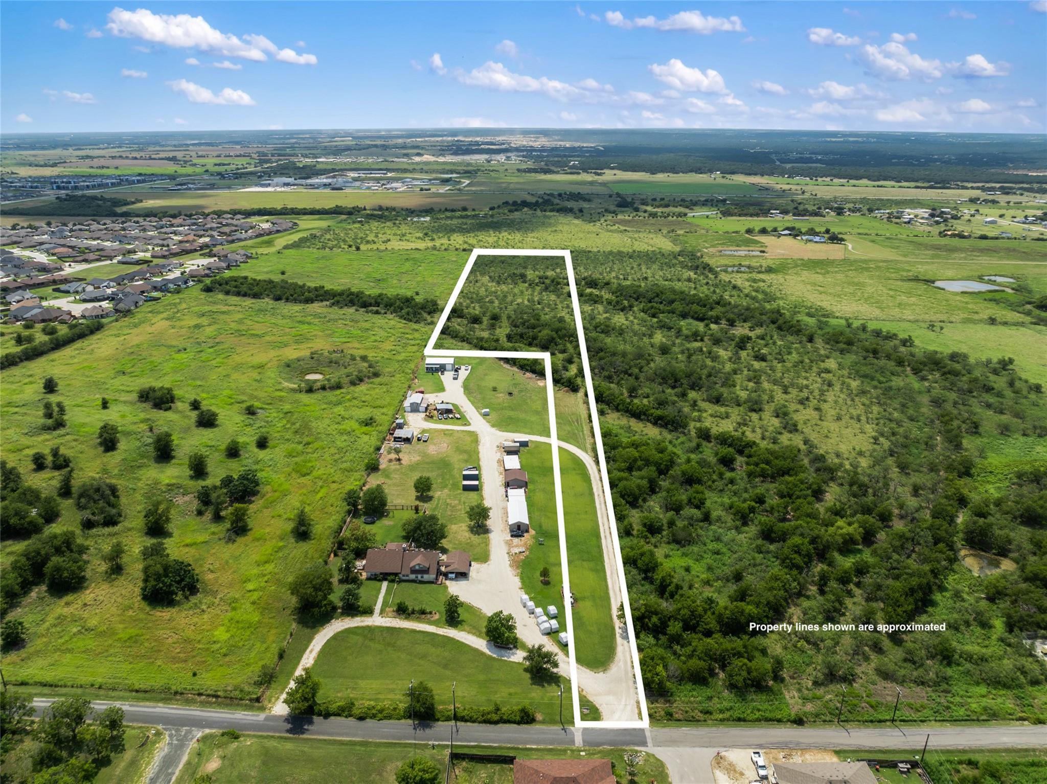 Aerial view of property and surrounding area with