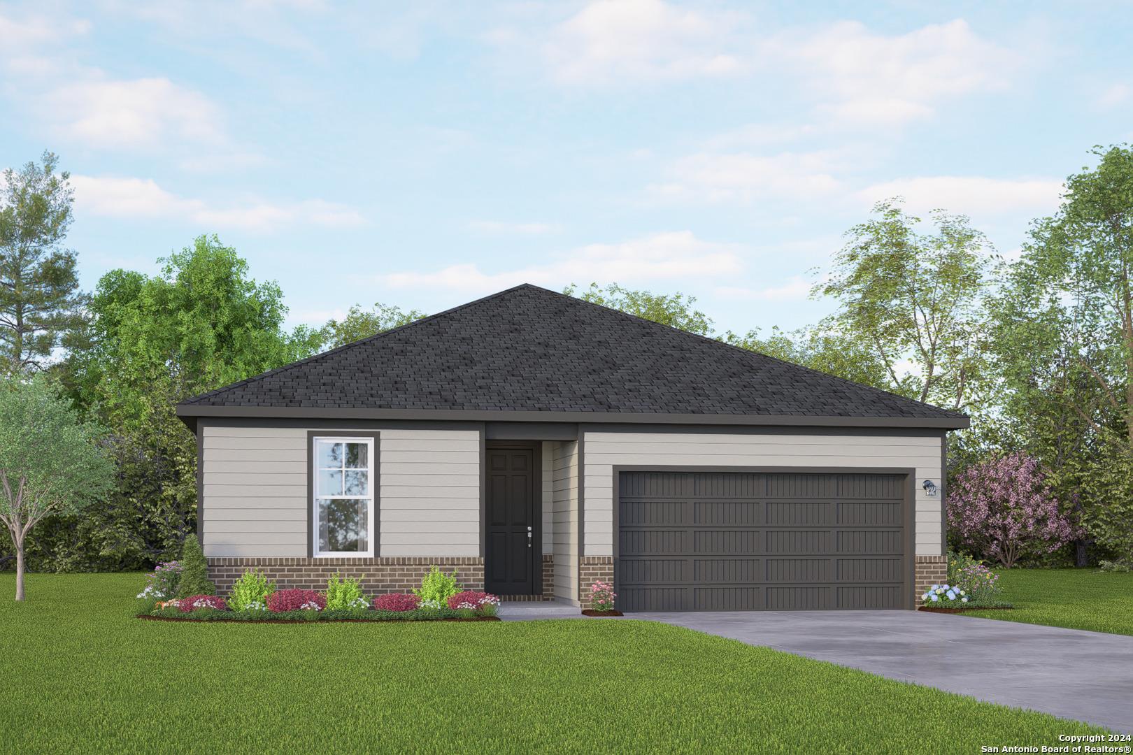 Ranch-style house featuring a front lawn, drivewa
