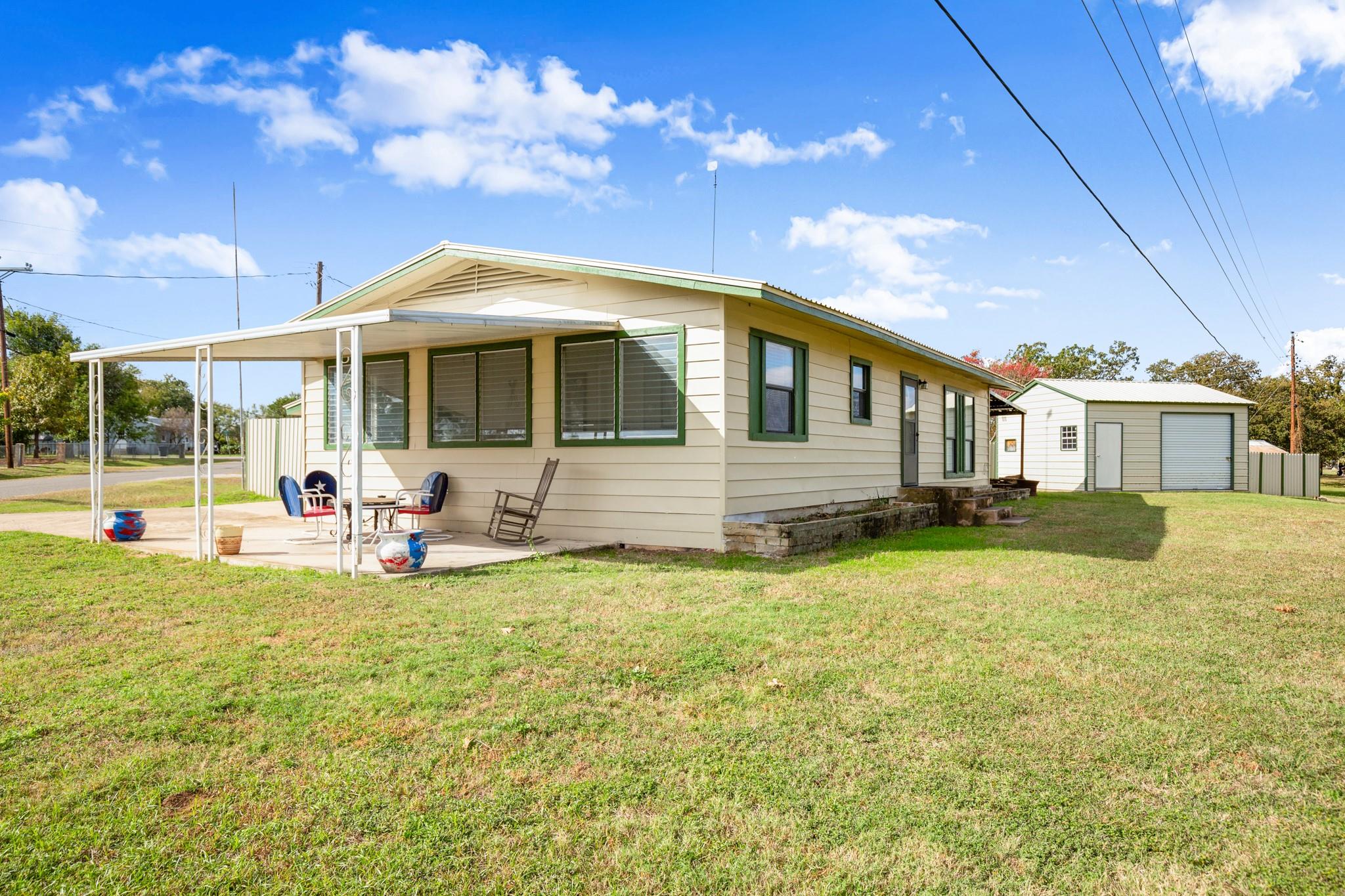 View of home's exterior with a patio and an outdo