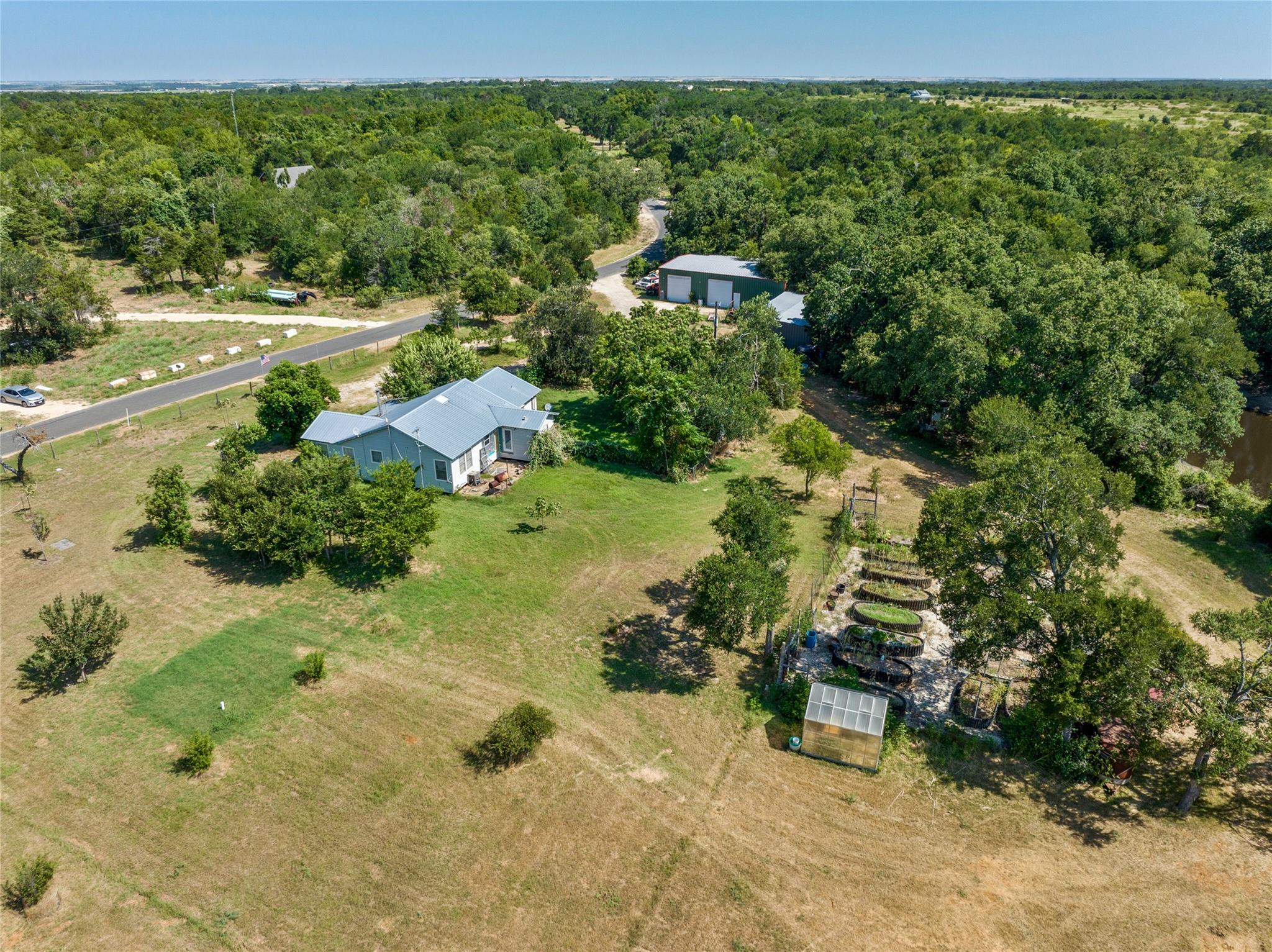 View from above of property featuring a forest