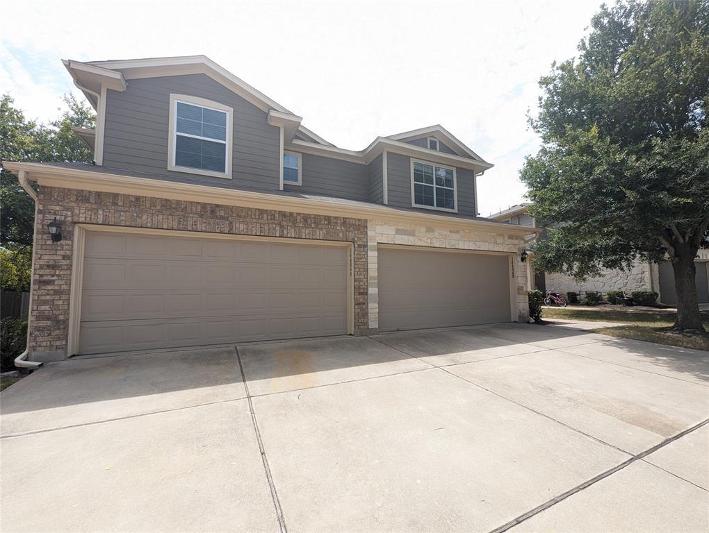 View of front facade featuring an attached garage