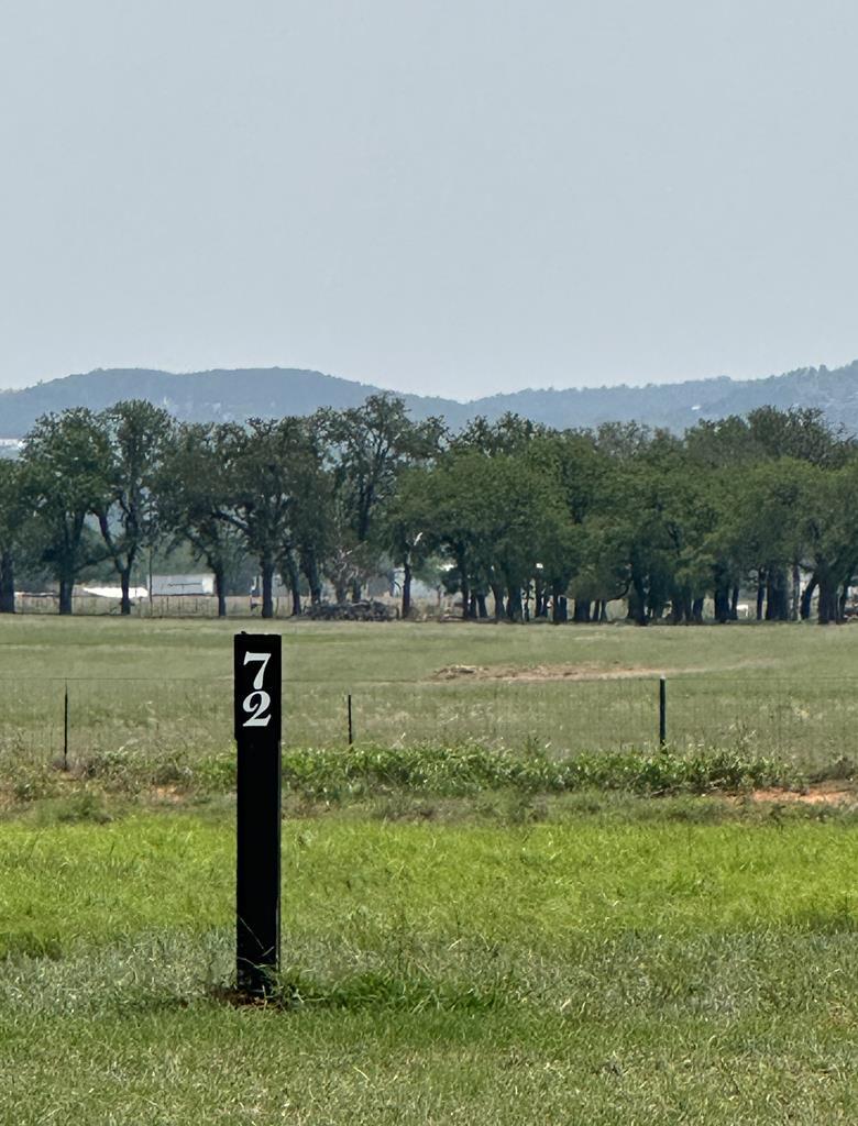 View of mountain background featuring rural lands