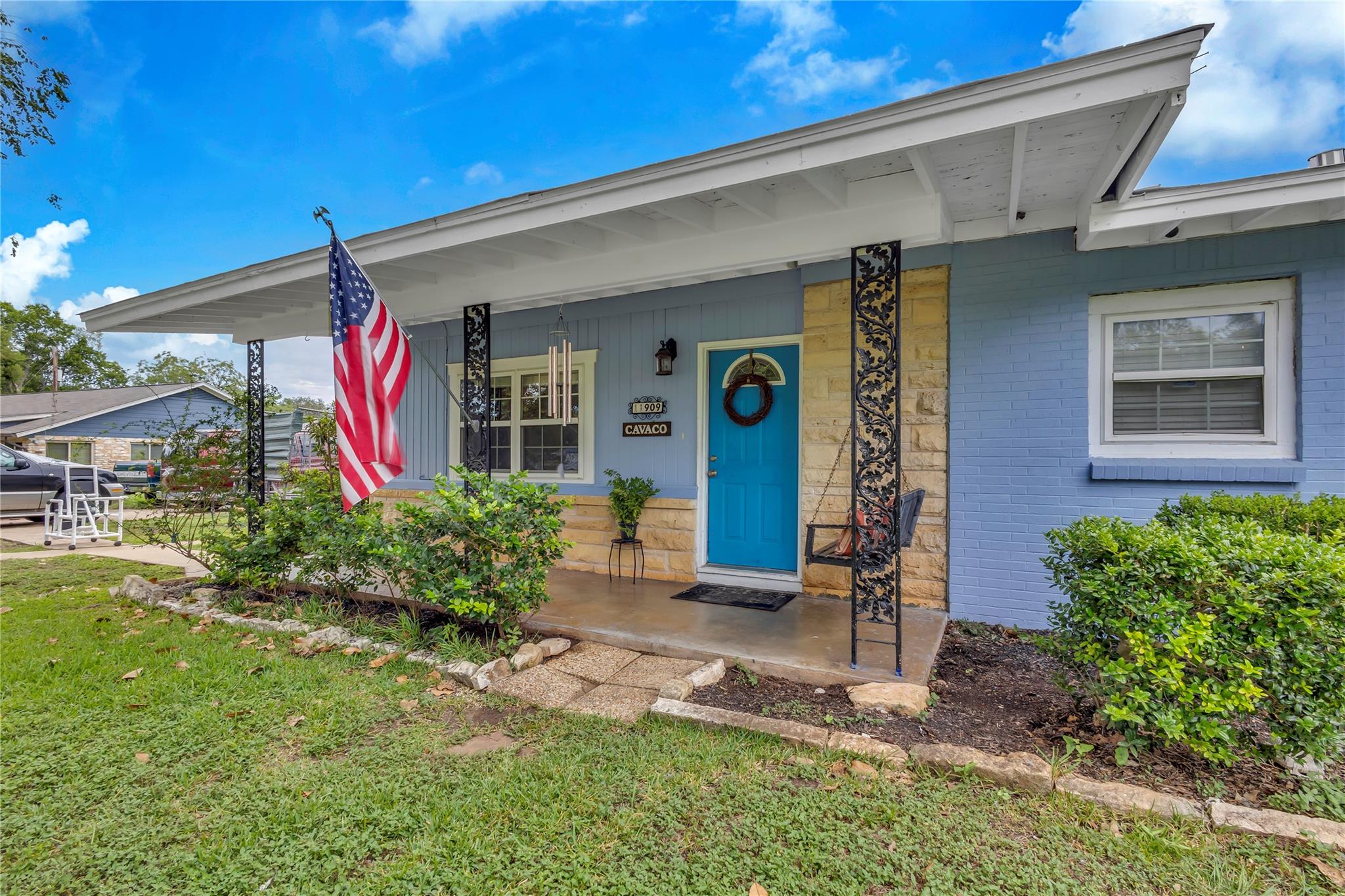 View of front of house with covered porch, brick 