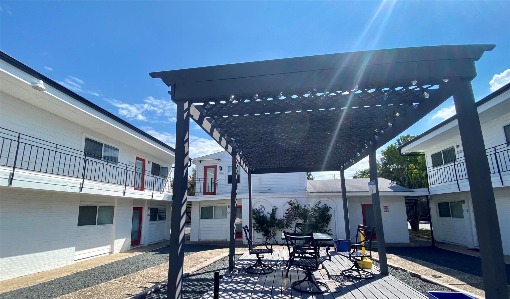 View of patio with a pergola, a deck, and outdoor