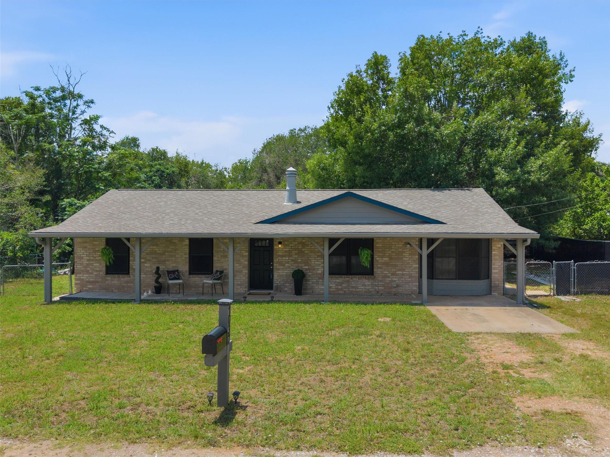 A charming single-story brick home with an inviti