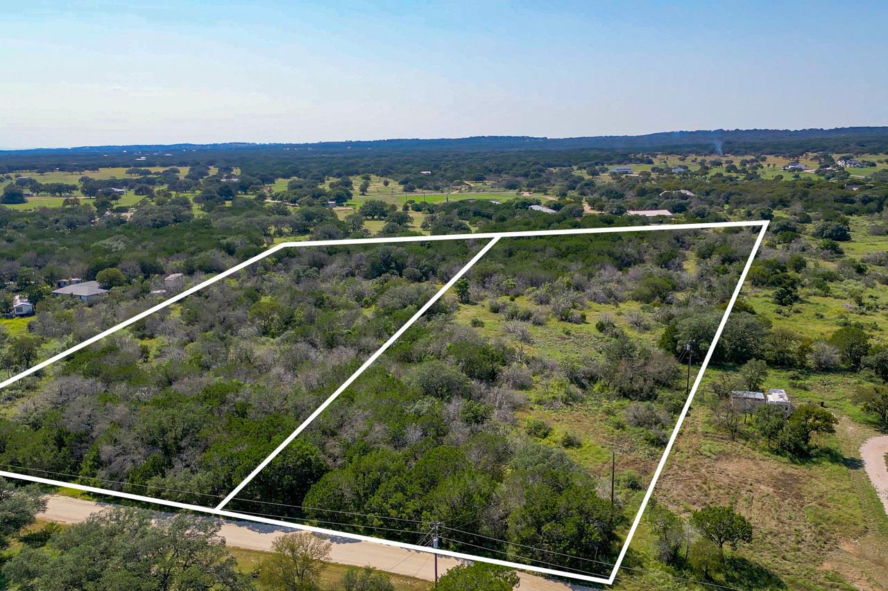 Aerial view of property and surrounding area with