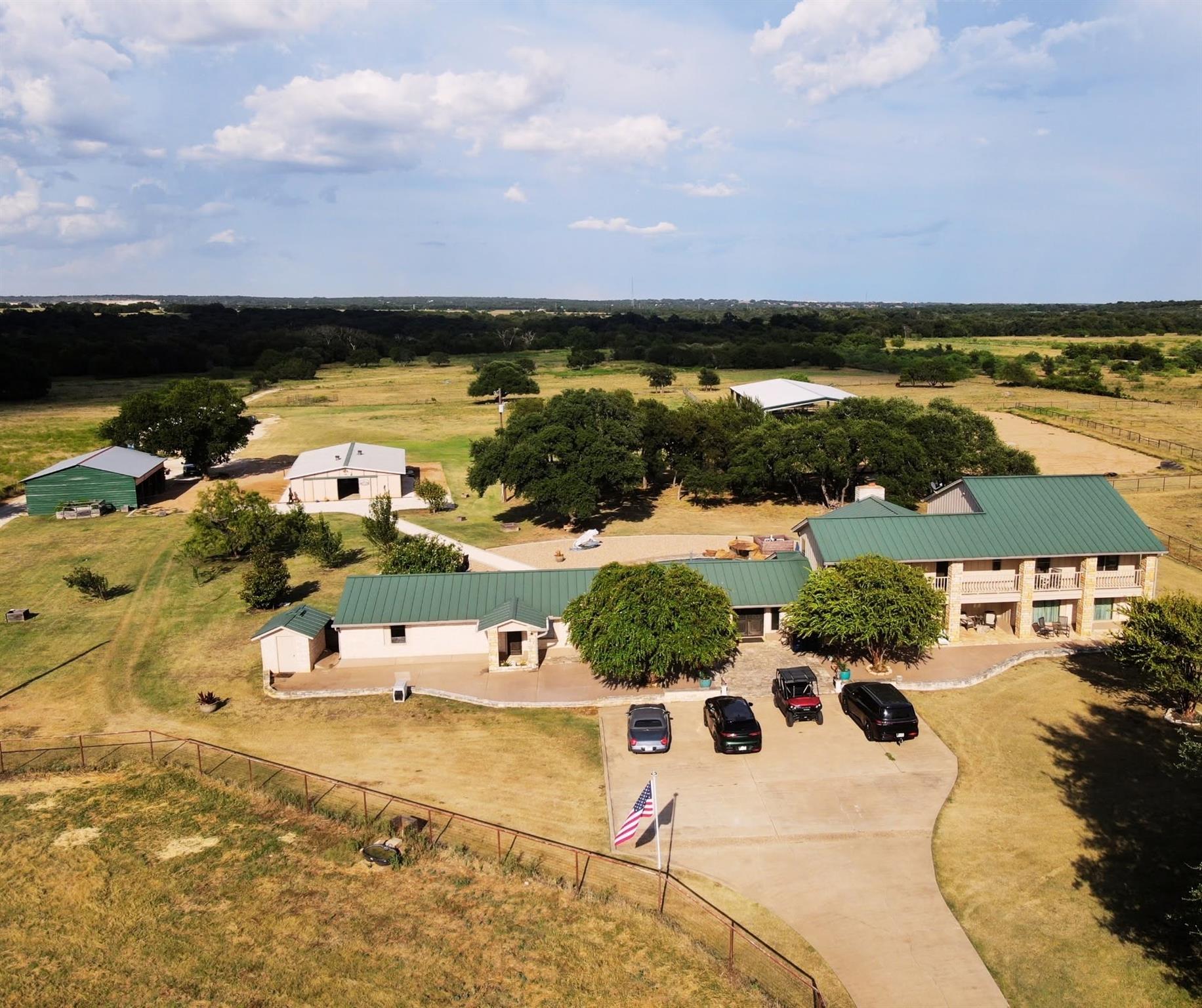 An expansive rural compound features multiple out