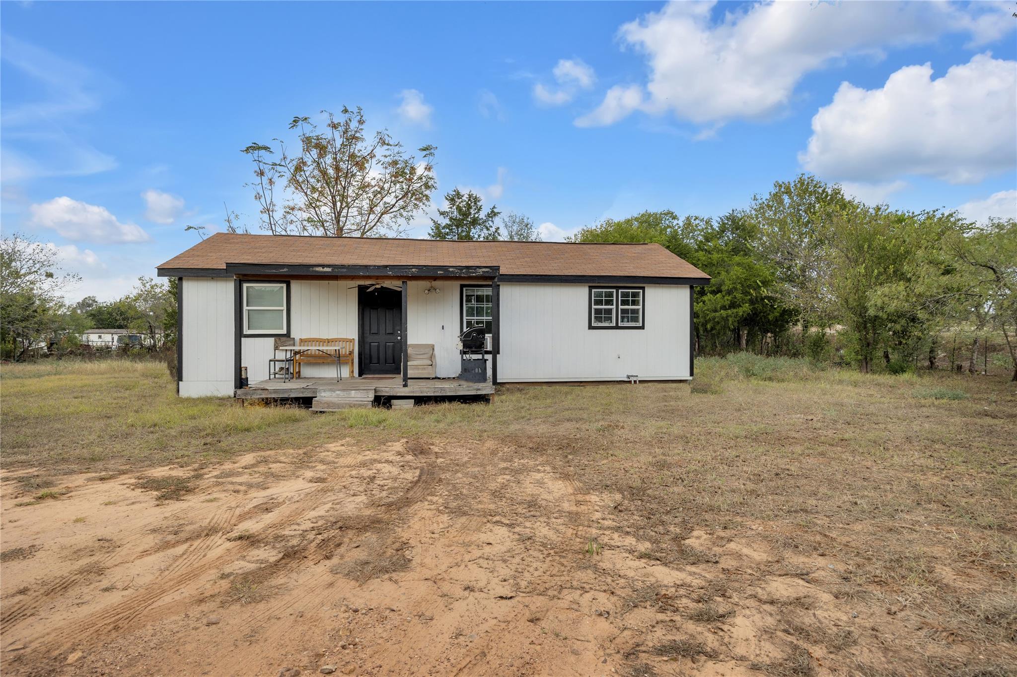 Rear view of property with a porch